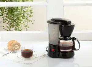 autodrip coffee maker next to a coffee