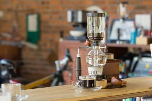siphon coffee maker sitting on a worktop